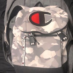 I’m selling a White,Gray,Black,Red Champion Top load backpack.